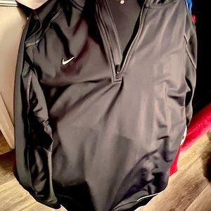 Very sleek, charcoal grey performance hoodie, dri fit fabric.